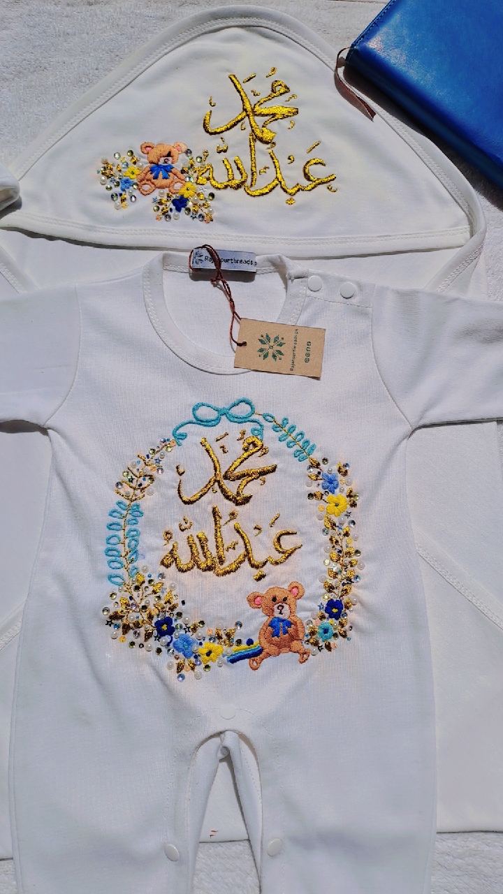 Fabric: Soft Blended Cotton (gentle on baby skin) Includes: Romper + Embroidered Wrapping Sheet Hand Embroidery with name customisation Decorated with floral motifs, pearls & teddy bear design Suitable for newborn to 3 months Ideal for gifting & memorable keepsakes